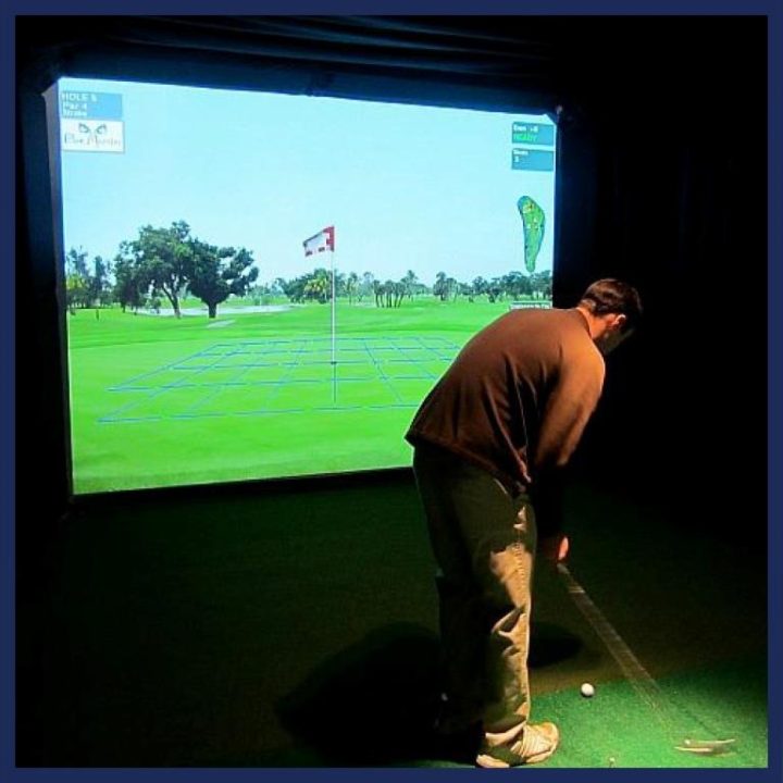 A man playing virtual golf