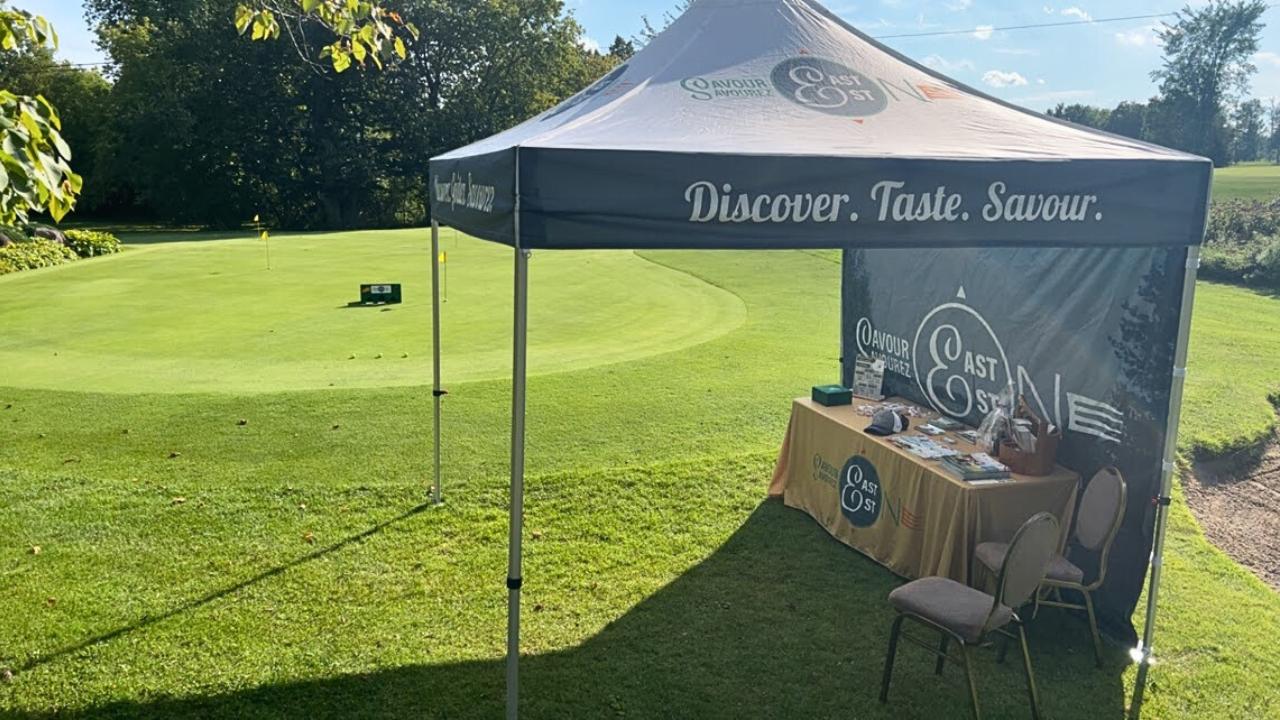 Savour East Ontario booth set up near putting contest