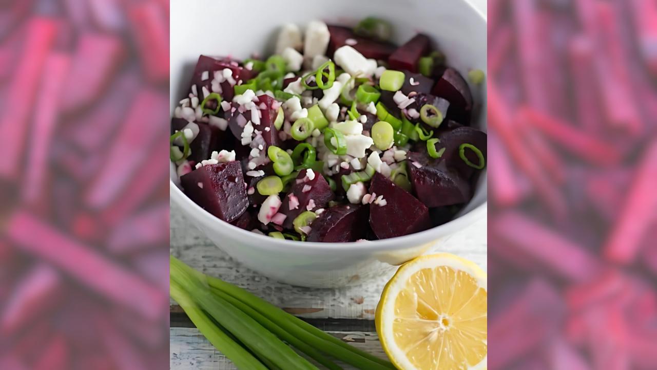 Beet salad in a bowl surrounded by